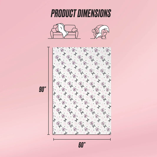 A graphic displays the Plush Oversized Throw Blanket (90"x60") on a pink background. Above, illustrations show its ultra-soft texture as it covers a couch and person. The blanket features a white base with repeating black and pink designs.