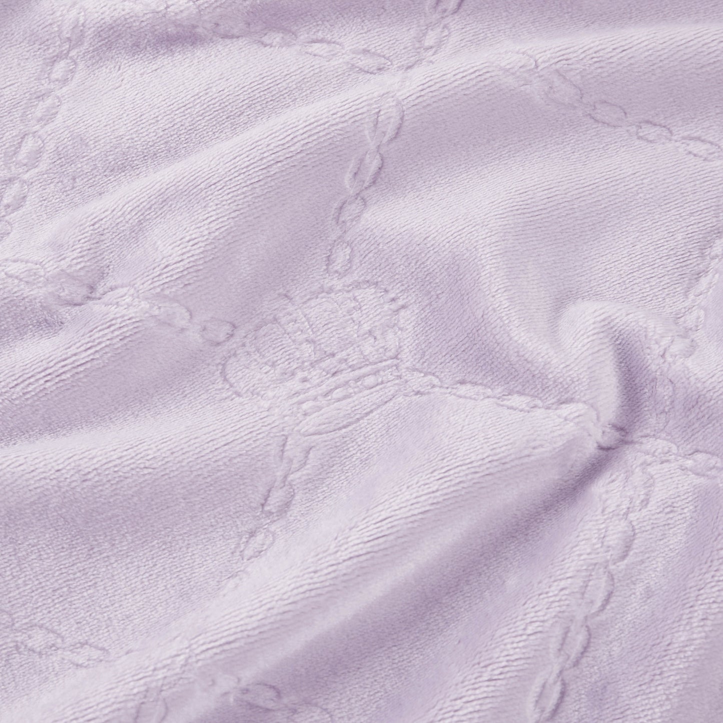 Light purple textured fabric with embossed crowns and chain-like grid lines creates a soft, cozy Plush Oversized Throw Blanket, 60" x 90". Perfect for adding Juicy Couture-inspired elegance to any twin bed.