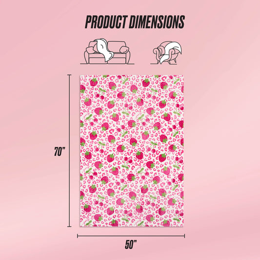 A pink background displays the Kids Plush Throw Blanket by Juicy Couture, featuring a floral pattern and ultra-soft texture, sized 70"x50". Icons above show it draped over a sofa and person, labeled Product Dimensions.