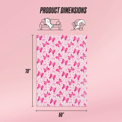 The Kids Plush Throw Blanket measures 70"x50" and features vertical pink ribbon designs. Ultra-soft and cozy, it’s perfect for lounging—ideal for use on a couch or while relaxing.
