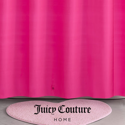 A bright pink PEVA Shower Curtain Liner hangs above a light pink, heart-shaped rug with speckles. The words Juicy Couture Home are printed in black at the bottom center of the image.
