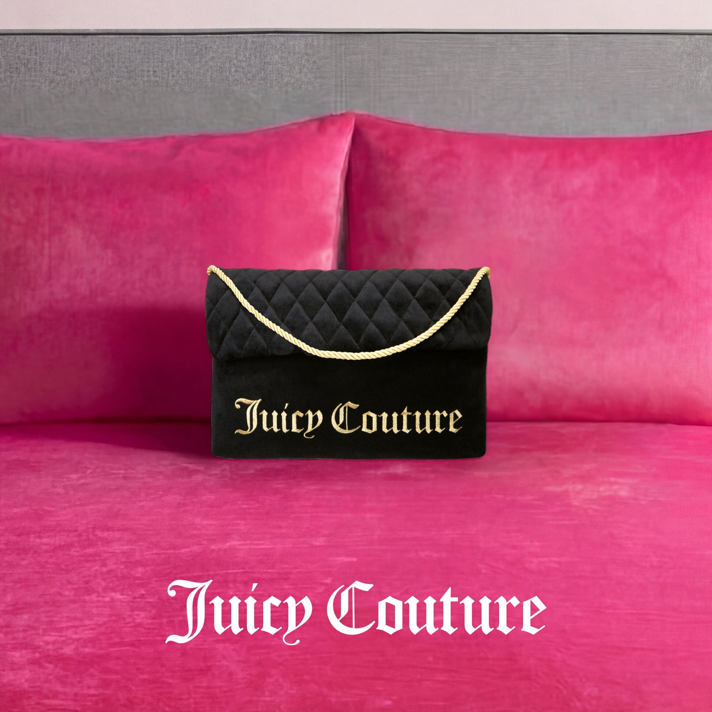 A Purse Decorative Pillow inspired by Juicy Couture, featuring black fabric with gold lettering and a gold rope handle, sits on a bright pink velvet bed accented with matching trendy pillows. The Juicy Couture logo appears in white on the bed.