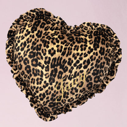 The Heart Shaped Decorative Pillow features a pink cheetah print design, ruffled edges, and gold "Juicy" script—an ideal accent piece for any Juicy Couture fan’s room.
