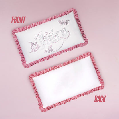 The Ruffle Decorative Pillow is rectangular and white with pink ruffles. The front shows decorative text, butterfly designs, and rhinestones; the back is plain white with matching ruffles. Both sides are labeled FRONT and BACK on a pink background.