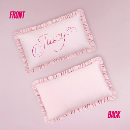 Two light pink Juicy Couture Ruffle Decorative Pillows with rectangular shapes rest on a pink background. The front pillow sparkles with "Juicy" in pink rhinestones; the back pillow is plain. FRONT and BACK labels are shown.