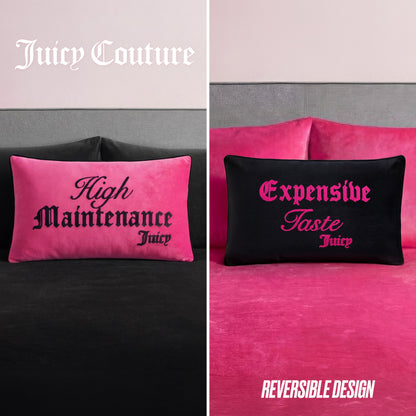 The Reversible Decorative Pillow features pink fabric with "High Maintenance Juicy" in black on one side and black fabric with "Expensive Taste Juicy" in pink on the other—a chic accent perfect for your bed.