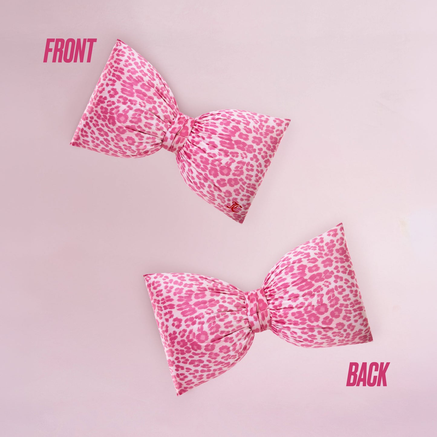 The Bow Decorative Pillow in pink leopard print is displayed on a light pink background, with FRONT showing the top and BACK showing the bottom view to highlight both sides of the bow.