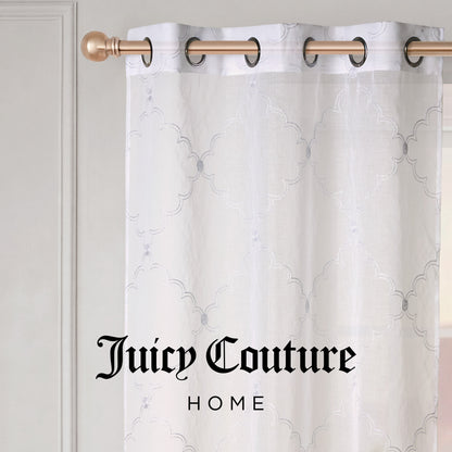 A sheer white Scallop Diamond Sheer Window Curtain with a subtle geometric pattern hangs on a gold rod, featuring a grommet header for easy installation. The text Juicy Couture HOME is centered at the bottom of the image, highlighting the elegant style of Juicy Couture curtains.