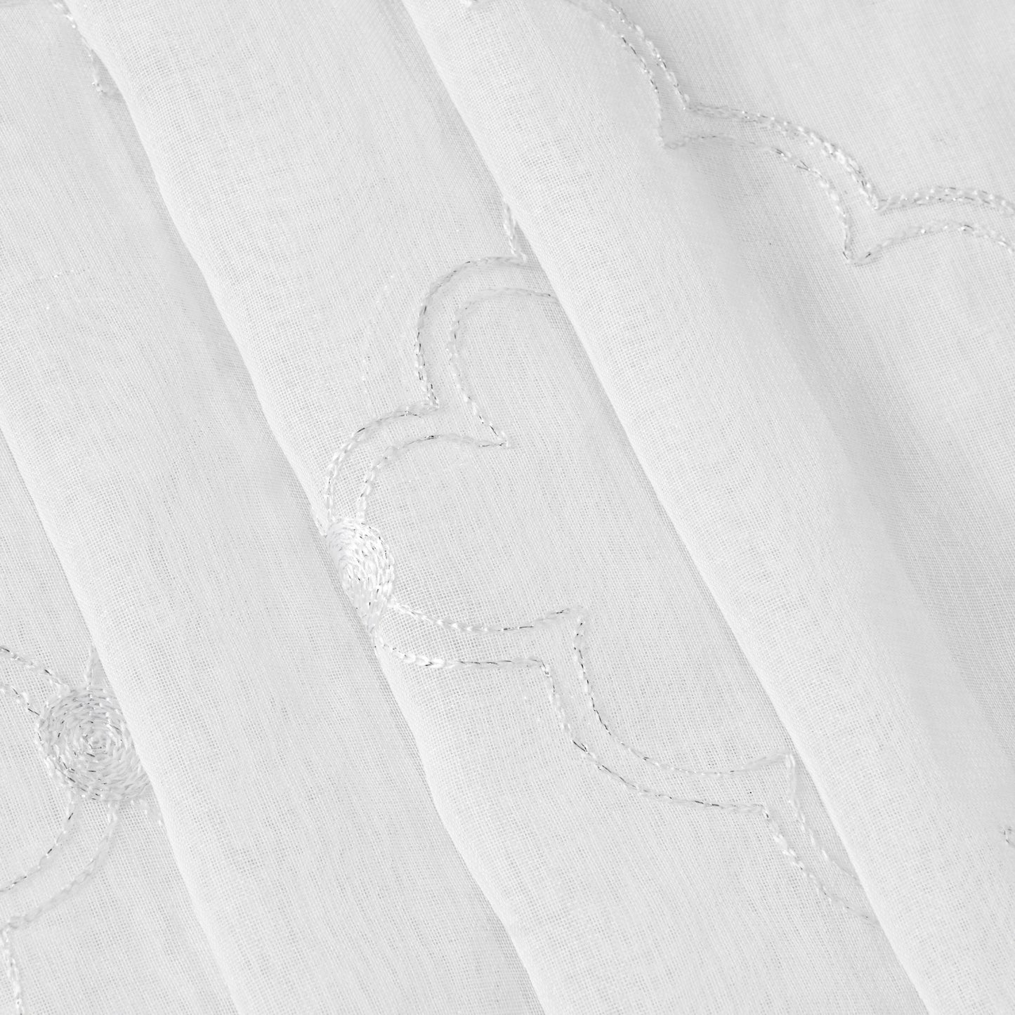 The Scallop Diamond Sheer Window Curtain features airy white fabric adorned with a delicate stitched scallop and diamond pattern, as highlighted in close-up detail. Lightweight and semi-transparent, this material softly filters daylight—making it an ideal choice for sheer window curtains that add both elegance and gentle illumination to your space.