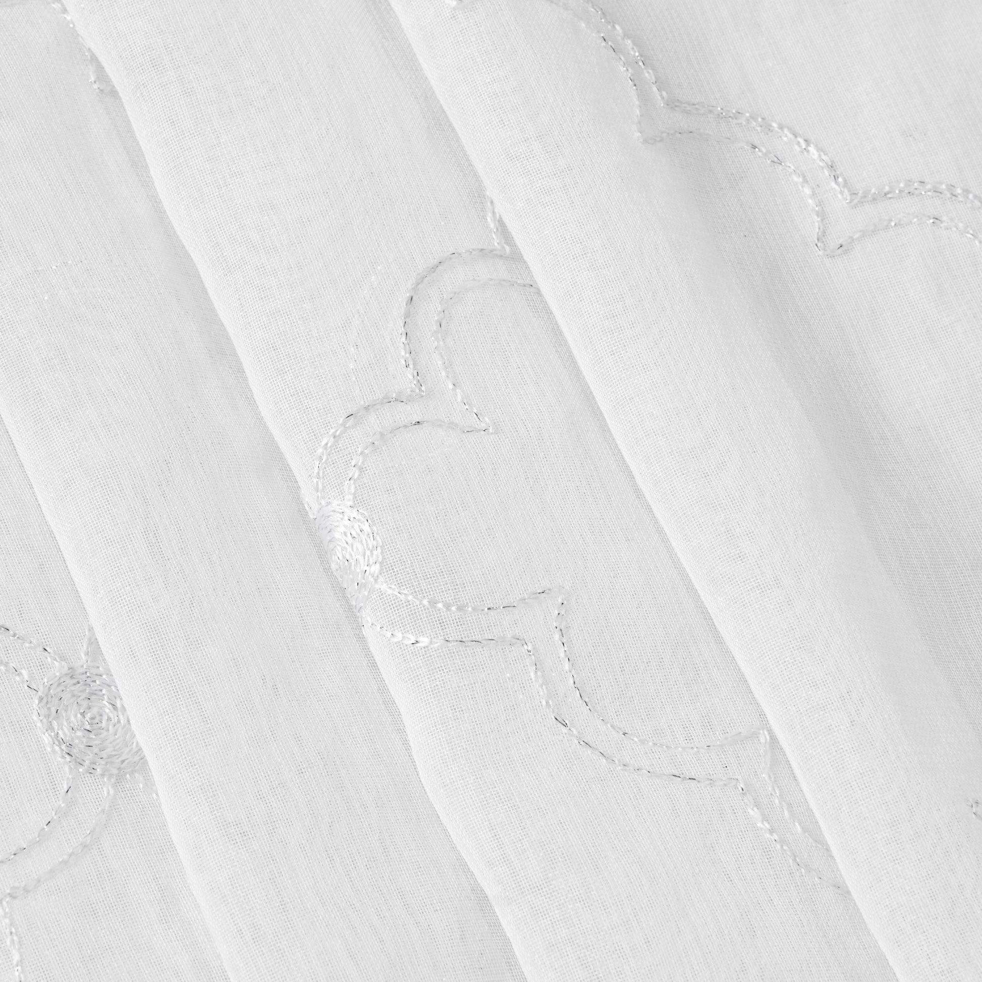The Scallop Diamond Sheer Window Curtain features airy white fabric adorned with a delicate stitched scallop and diamond pattern, as highlighted in close-up detail. Lightweight and semi-transparent, this material softly filters daylight—making it an ideal choice for sheer window curtains that add both elegance and gentle illumination to your space.