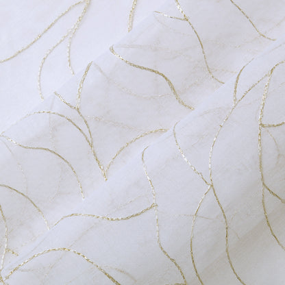 Rose Swirl Sheer Window Curtains feature white fabric adorned with delicate, curved gold lines forming an abstract, wavy pattern. The slightly raised lines add texture and an elegant, decorative touch to the smooth surface, making these curtains perfect for a grommet header style that blends sophistication with modern appeal.