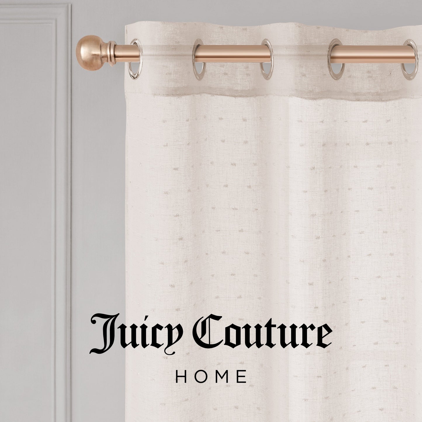 The cream-colored Aurora Sheer Window Curtain with a grommet header hangs on a gold rod. "Juicy Couture HOME" in black script appears at the bottom center of the image.