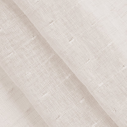 A close-up of the Aurora Sheer Window Curtain shows light beige, textured linen with a slightly open weave and visible threads, neatly folded in layers—perfect for creating soft, airy window treatments.