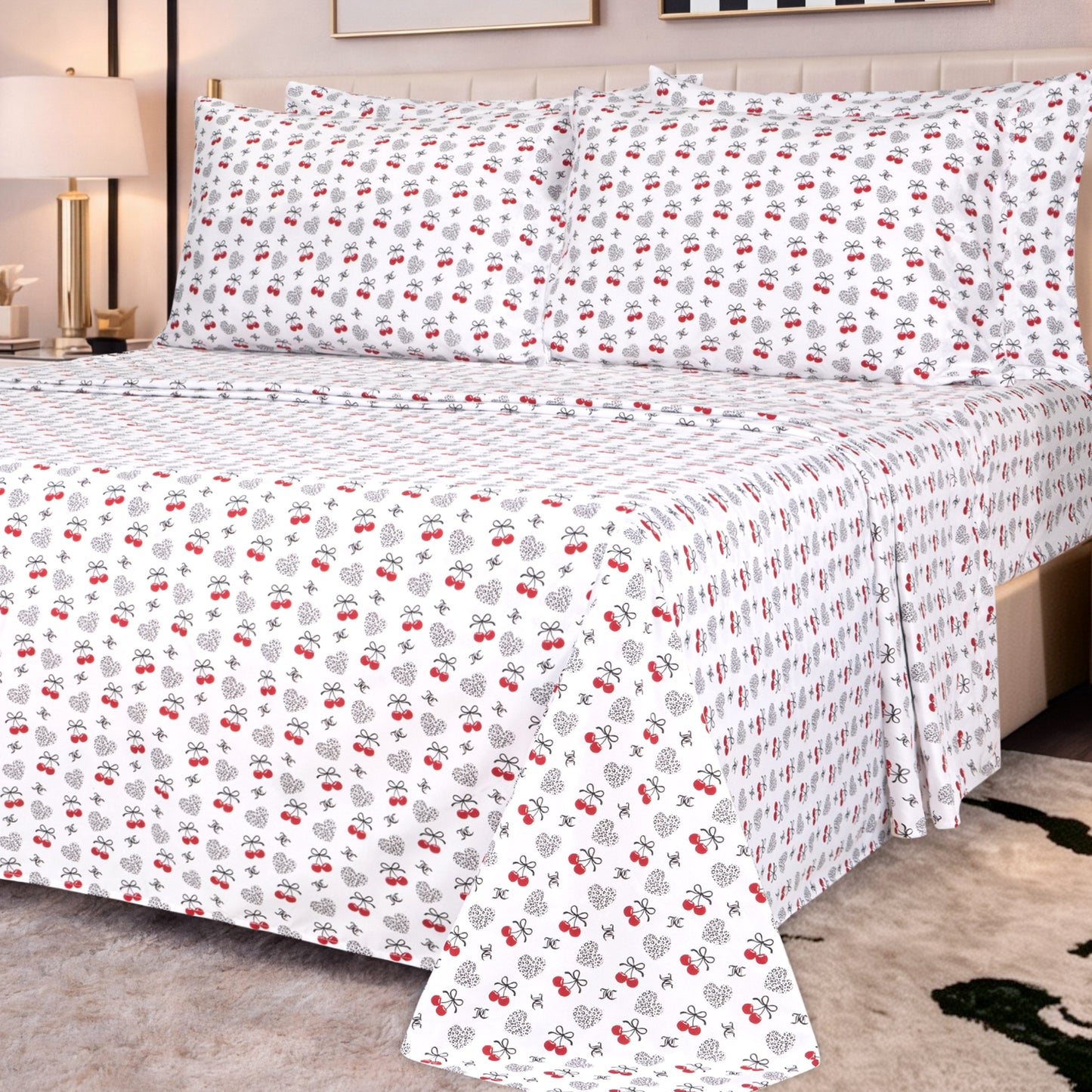 A neatly made bed with white sheets and pillowcases featuring a small red and black floral pattern, set in a modern bedroom with neutral furniture and soft lighting, showcases the plush comfort of the Microfiber Sheet Set With Extra Pillowcases for an added touch of luxury bedding.
