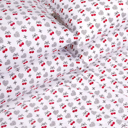 Indulge in luxury bedding with the Microfiber Sheet Set With Extra Pillowcases, showcasing white fabric embellished with black bows, polka-dotted hearts, red cherries, and dainty logo-inspired motifs for a playful and whimsical look. Crafted from premium microfiber, this stylish sheet set delivers both soft comfort and charming appeal to elevate your bedroom retreat.