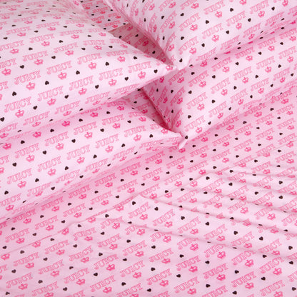 The Microfiber Sheet Set With Extra Pillowcases features ultra-soft pink sheets and pillowcases adorned with a playful, all-over “JUICY” print, accented by hearts, crowns, and stars in varying shades of pink and black. Crafted from smooth microfiber for a youthful touch, this set is perfect for fans of Juicy Couture bedding.
