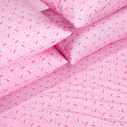 Transform your bedroom with the Microfiber Sheet Set With Extra Pillowcases, featuring pink bed sheets and pillowcases adorned with small cherries and leopard-like spots. This playful and colorful bedding set brings a charming, Juicy Couture-inspired aesthetic to your space. Enjoy the luxurious feel of quality microfiber combined with whimsical design details for a truly unique bedding upgrade.