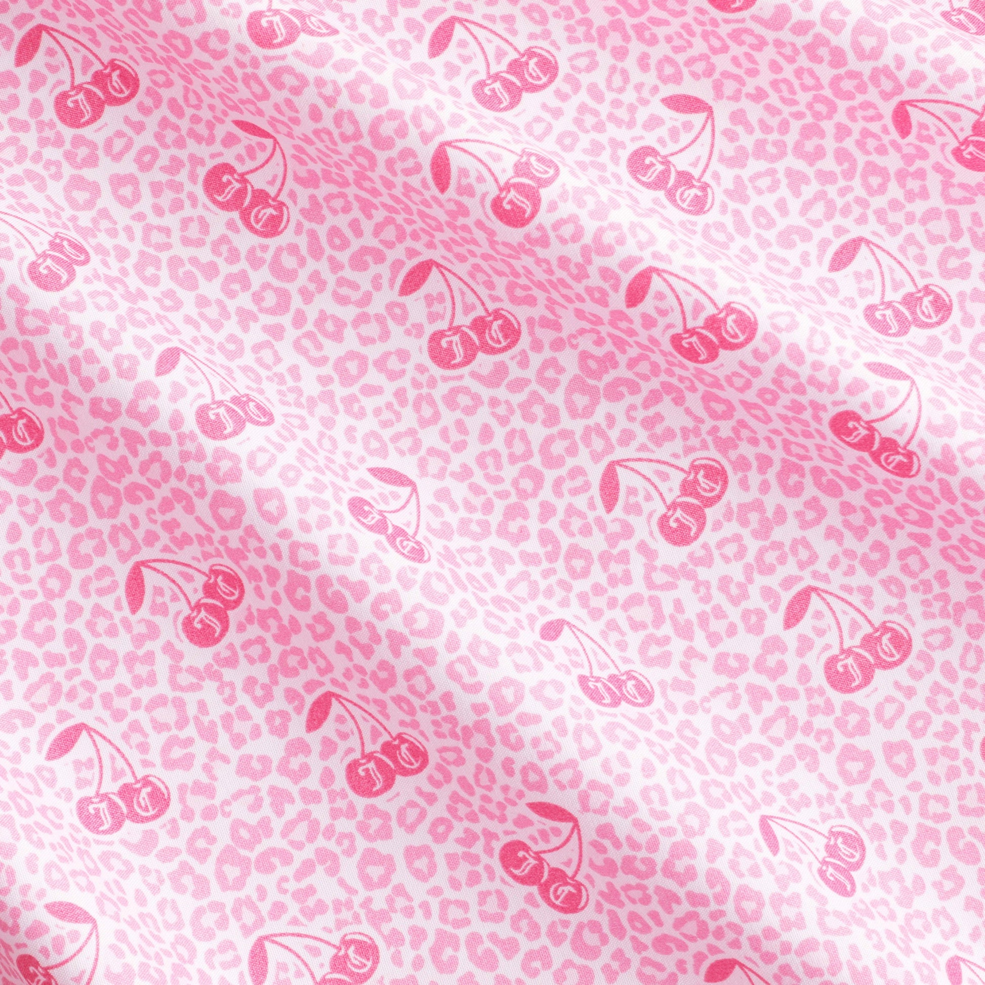 Bring a playful yet sophisticated touch to your bedroom with the Microfiber Sheet Set With Extra Pillowcases, featuring soft pink fabric adorned with a light pink leopard print and darker pink cherry illustrations arranged in a repeating diagonal pattern across the surface.
