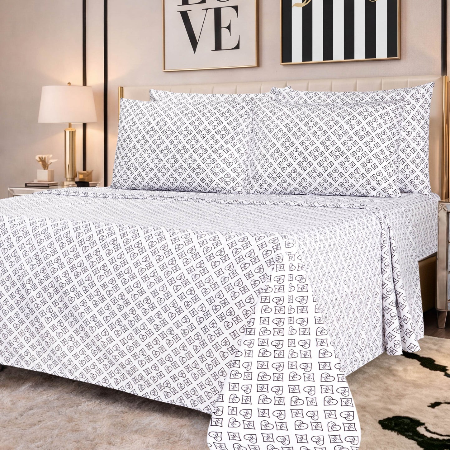 A neatly made bed features the Microfiber Sheet Set With Extra Pillowcases, showcasing crisp white sheets and pillowcases adorned with a small geometric pattern in a modern bedroom with framed wall art, a lamp, and a beige headboard.
