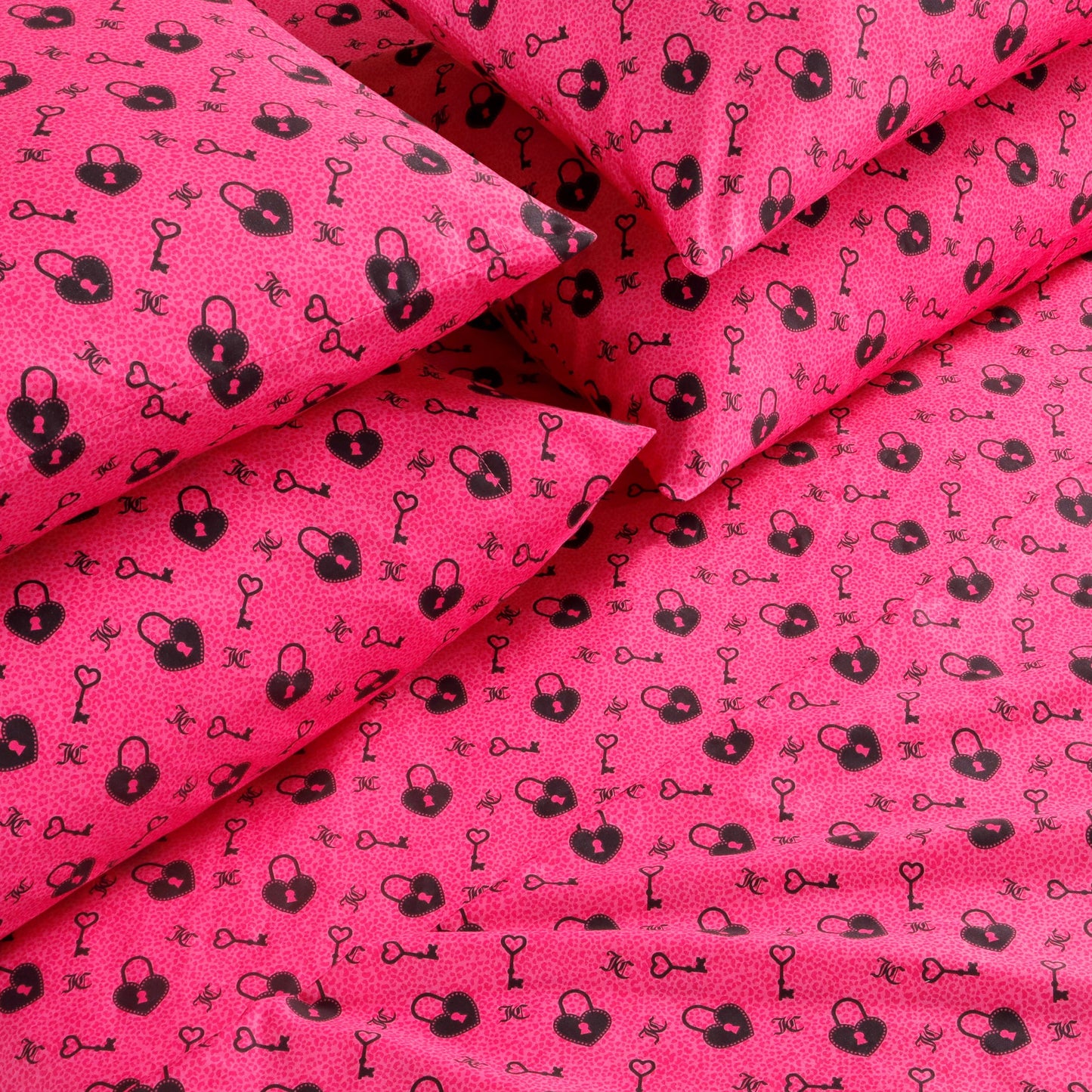 Bring playful boldness to any room with the Microfiber Sheet Set With Extra Pillowcases, featuring bright pink bedding adorned with a repeating pattern of black handcuffs and keys. This set is crafted from soft microfiber for a luxuriously comfortable feel and includes extra pillowcases, ensuring the eye-catching design covers both pillows and sheets for a striking visual effect.