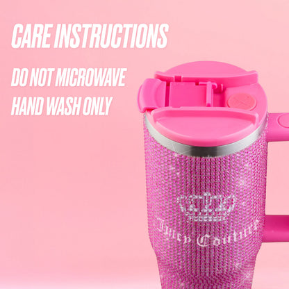 A Diamond Bling Stainless Steel Tumbler with Handle and Straw, 30 oz, covered in sparkling pink rhinestones and topped with a matching pink lid, sits against a pink background. Text beside it reads: Care Instructions. Do not microwave. Hand wash only.