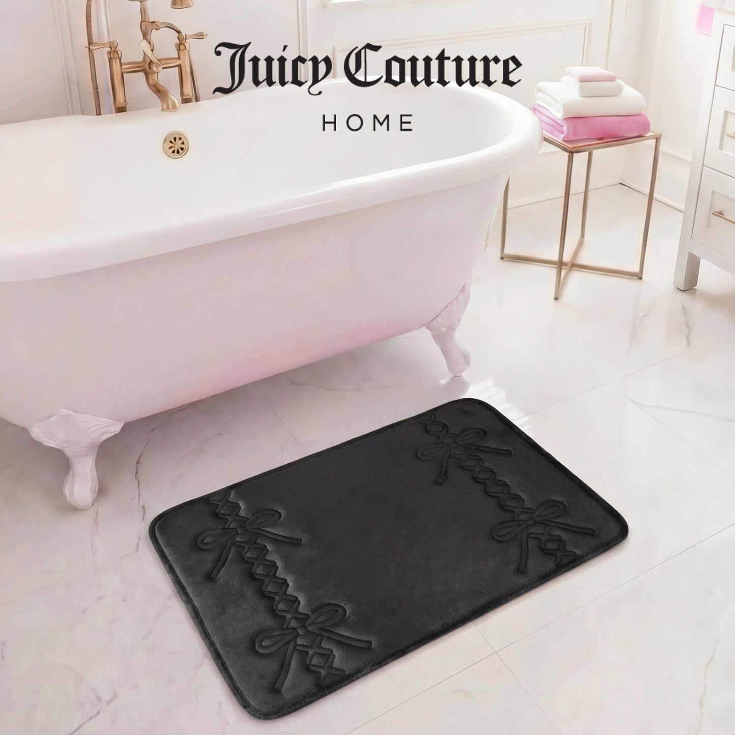 A white bathtub sits on marble flooring beside a plush Quilted Memory Foam Bath Mat (20" x 32"). Pink and white towels rest on a gold side table. "Juicy Couture Home" appears at the top.