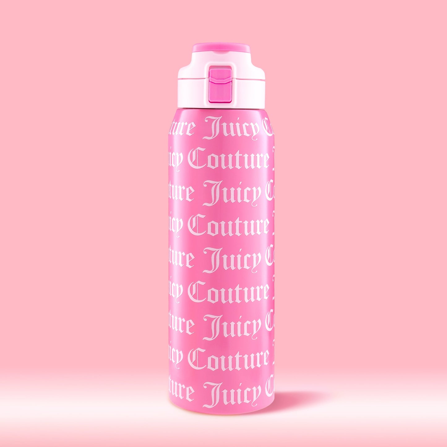 The Glam Getaway Hydration Stainless Steel Tumbler is a 32oz pink Juicy Couture tumbler with a white lid, flip-top spout, and “Juicy Couture” in bold white gothic letters—perfect for stylish, everyday hydration.