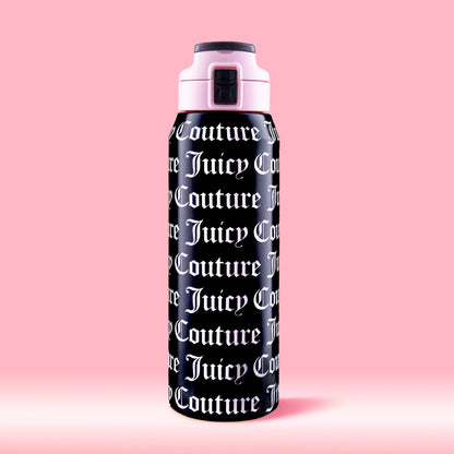 The Glam Getaway Hydration Stainless Steel Tumbler in black features bold white Juicy Couture logos across its surface, a pink and black lid, and is displayed against a solid pink background.