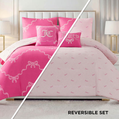 The Chevron Leopard Bow Reversible Comforter Set is shown on a bed, featuring bold pink with white bow designs and embroidered pillows on one side, and light pink with a subtle repeating pattern on the reverse. “REVERSIBLE SET” appears at the bottom.