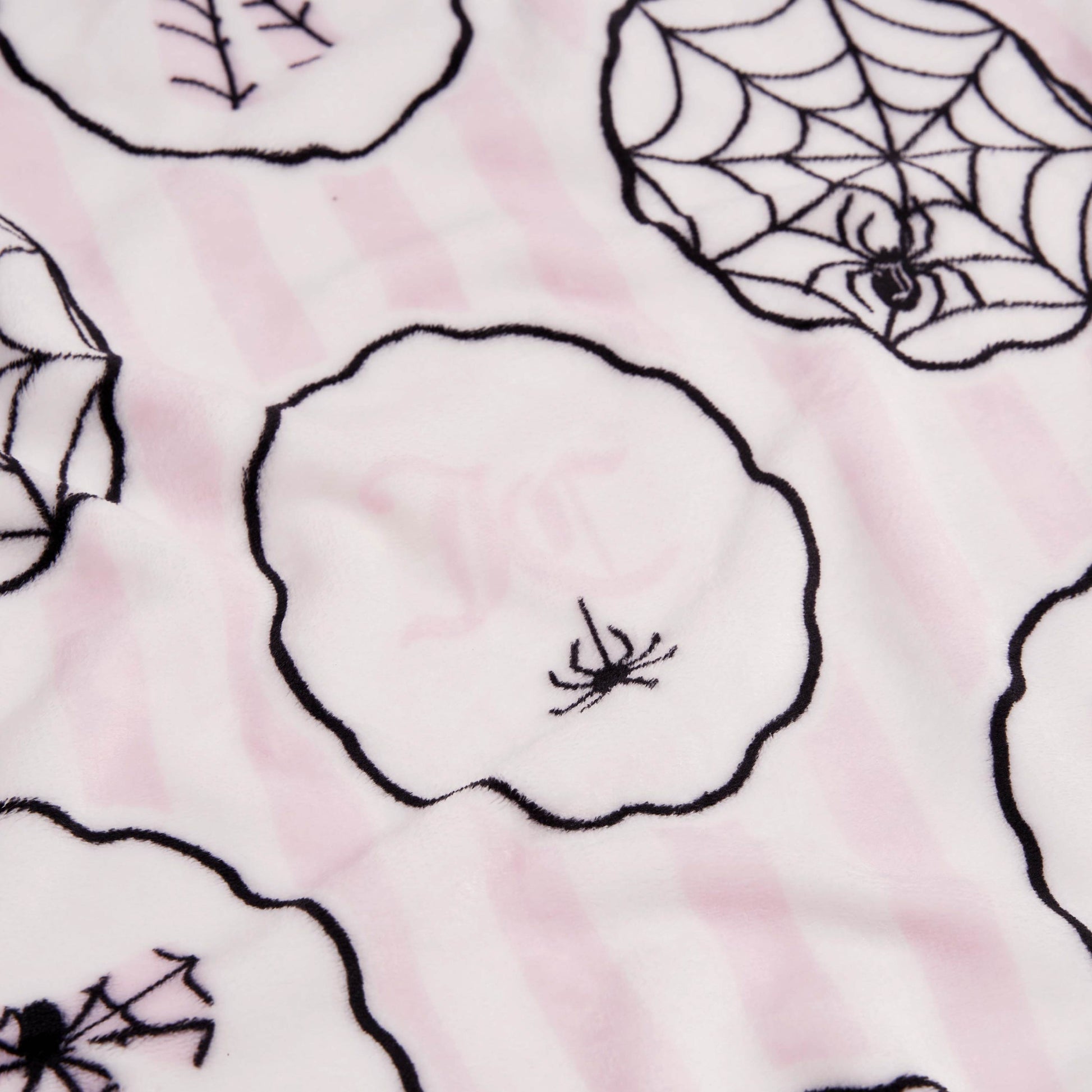 The Halloween Plush Throw Blanket 50" x 60" features soft fabric with light pink and white stripes, black-outlined circles, and line art spiders and webs—perfect for cozy, festive décor.
