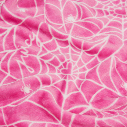 The Halloween Plush Throw Blanket 50" x 60" features pink fabric with a white spiderweb, small spiders, a heart at the web’s center, and “Juicy” in script—perfect as a cozy Juicy Couture Halloween or plush throw blanket.