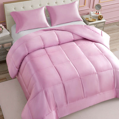A neatly made bed features the Solid Satin Down Alternative Comforter in light pink, providing all-season warmth and paired with matching pillows; the room showcases elegant decor, including a tufted headboard, nightstands, and soft pink walls.