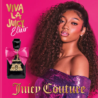A woman with voluminous curls and a shimmery purple top poses beside Viva La Juicy Elixir Eau de Parfum Spray, 1.7 oz, its pink bow sparkling. Bold gold Juicy Couture lettering stands out against the pink background for added glamour.