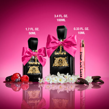 Three bottles of Viva La Juicy Elixir perfume for women on a pink background with flowers, berries, and vanilla pods: two black bottles with gold details and pink bows (50ml & 100ml) plus one Viva La Juicy Elixir Eau de Parfum Spray Pen, 0.33 oz.