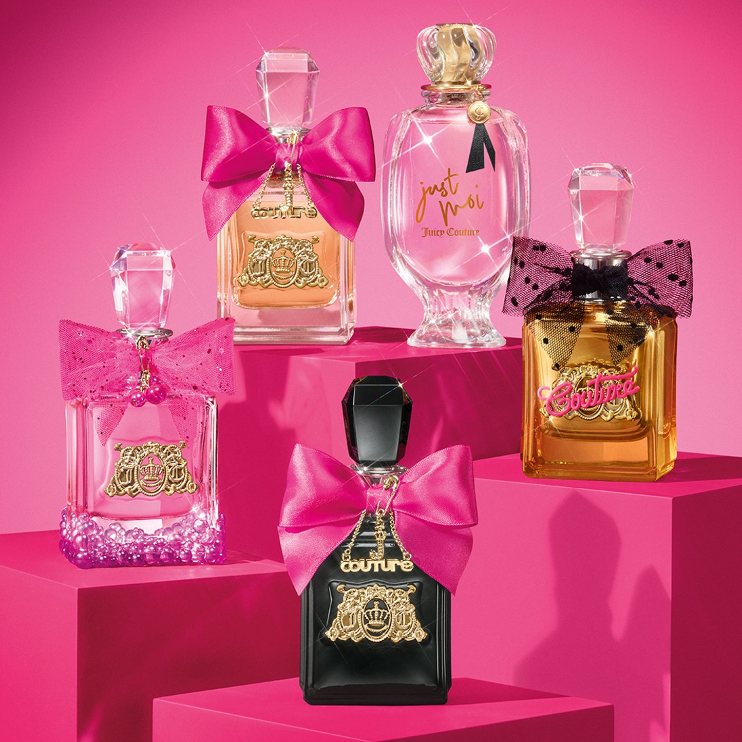 The Viva La Juicy Elixir Eau de Parfum Spray Pen, 0.33 oz, shines with its gold label and pink bow, showcased on a vivid pink platform against a matching background—highlighting this iconic women’s fragrance.