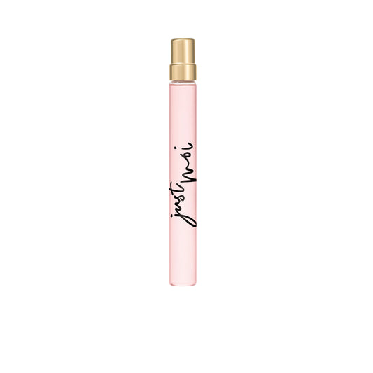 A slim, cylindrical pink Just Moi Intense Eau de Parfum Spray Pen (0.33 oz) with a gold cap and black cursive lettering. This women’s scent features Amber Vanilla notes, presented against a plain white background.