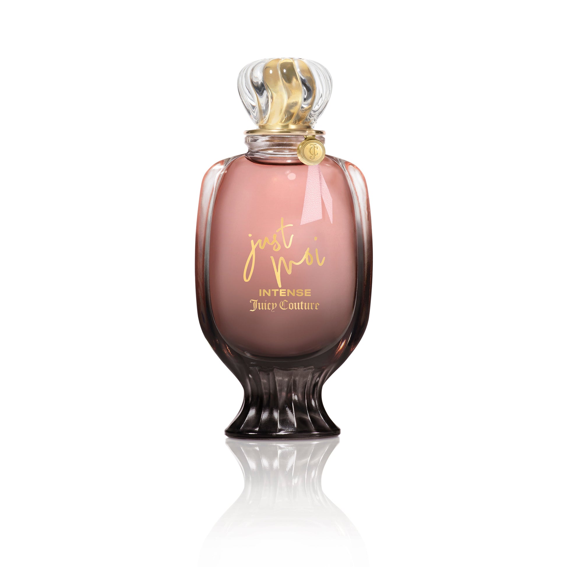 A pink and gold Just Moi Intense Eau de Parfum Spray, 3.4 oz by Juicy Couture stands upright on a white background, featuring a decorative cap and curved glass—an Amber Vanilla scent designed for women.