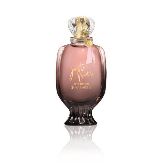 A pink and gold Just Moi Intense Eau de Parfum Spray, 3.4 oz by Juicy Couture stands upright on a white background, featuring a decorative cap and curved glass—an Amber Vanilla scent designed for women.