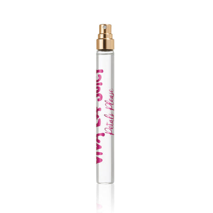 A clear glass Viva La Juicy Petals Please Eau de Parfum Travel Spray bottle with a gold nozzle and pink text, photographed on white, featuring a floral fruity essence inspired by Petals Please.