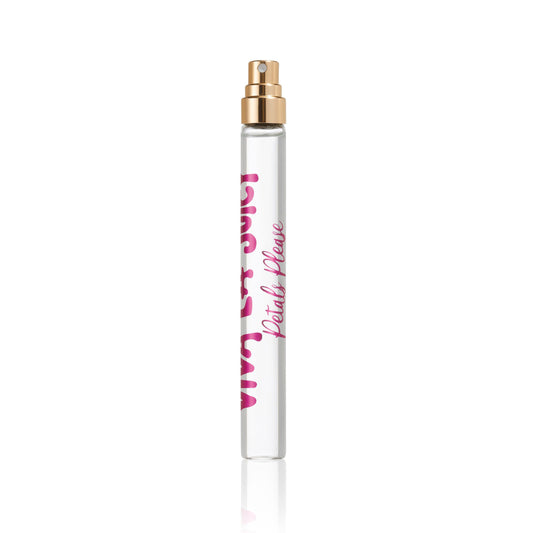 A clear glass Viva La Juicy Petals Please Eau de Parfum Travel Spray bottle with a gold nozzle and pink text, photographed on white, featuring a floral fruity essence inspired by Petals Please.