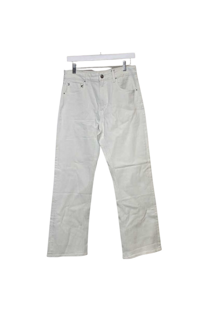 A Crochet Mini Skirt with a colorful waistband hangs on a white hanger against a plain white background.
